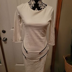 Super fun white dress, accentuates your curves. Used once.